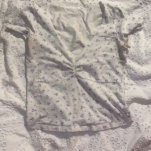 Brandy Melville floral white and blue top with stain